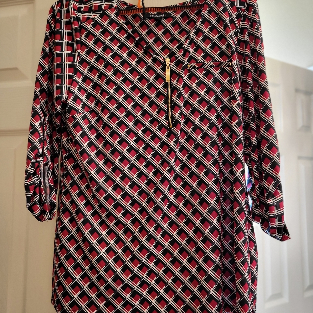 Womens black, red, white shirt with gold zipper In front and gold buttons on arm